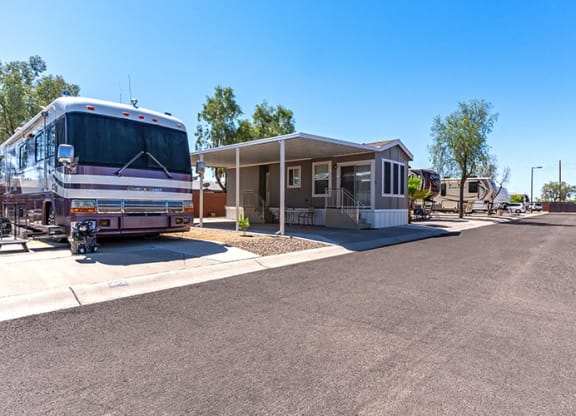 an parked in front of a building at a bus stop