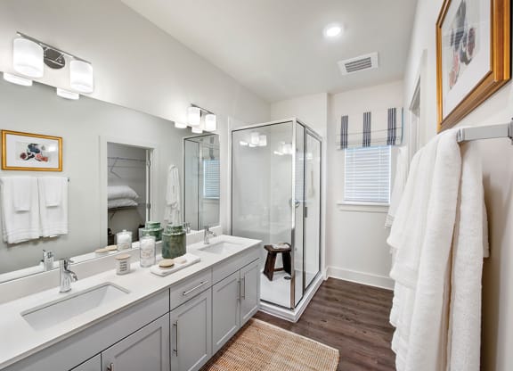 Bathroom with glass shower at the cottages
