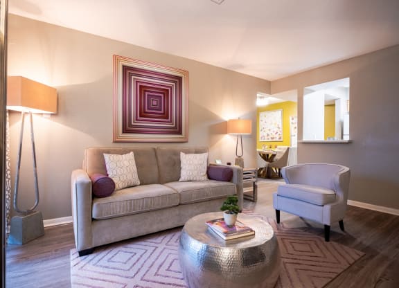 Living room with a couch chair and coffee table at Envue Apartments, Bryan, TX, 77802