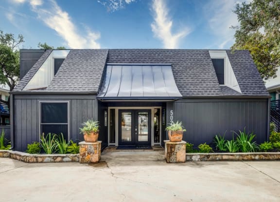 House with a black exterior and a gray roof  at The Wick, College Station, TX