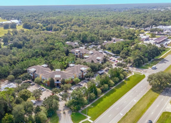 an aerial view of a neighborhood with houses and trees
