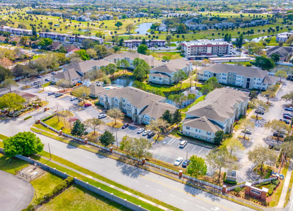 an aerial view of a neighborhood with houses and cars on the street
