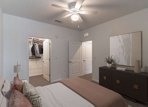 A bedroom with a bed, dresser, and mirror.