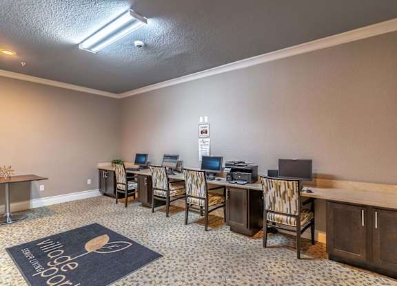 Business center room with computers and desks