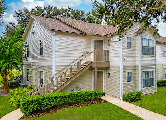 A two-story residential building with a staircase leading to the second floor.