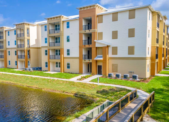 an apartment building overlooking a body of water