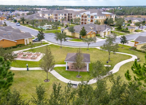 an aerial view of a neighborhood with houses and pathways