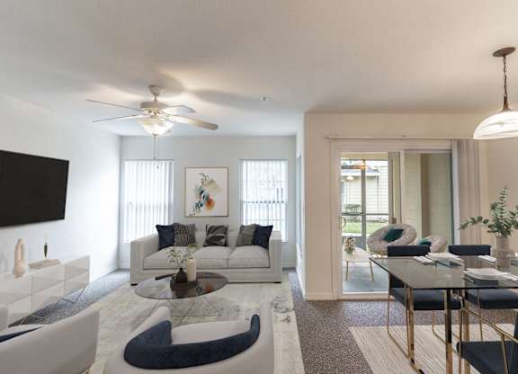 A modern living room with a glass coffee table and a white sofa.