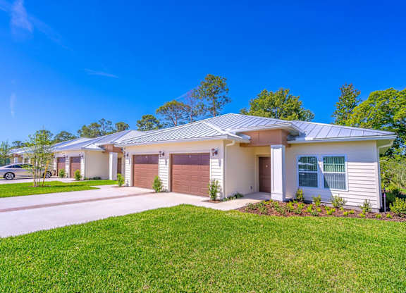 A modern house with a garage and a driveway.