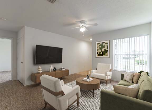A living room with a flat screen TV, a sofa, a chair, and a coffee table.