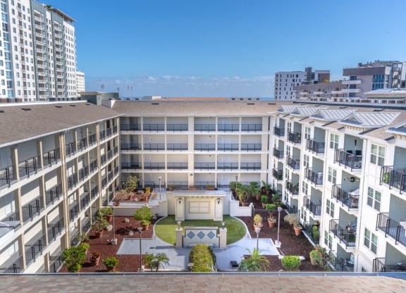 an aerial view of an apartment building with a courtyard