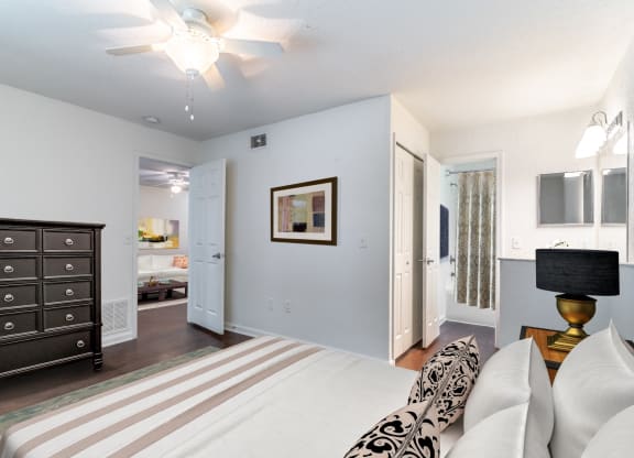 a bedroom with a bed and a dresser
