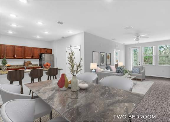 A modern two bedroom apartment with a kitchen area.