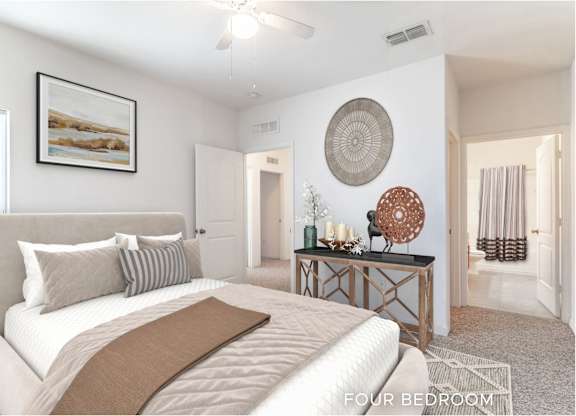 A bedroom with a large bed and a painting on the wall.