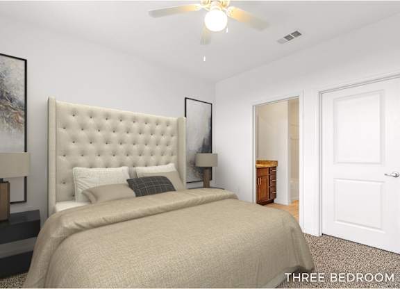 A bedroom with a large bed and a ceiling fan.