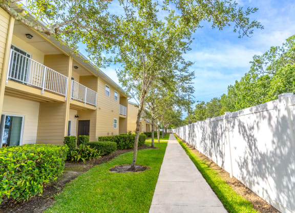 walking path with trees at Boca Townhomes