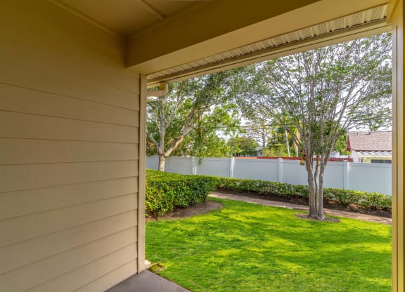 a view of the backyard from the front door of a house