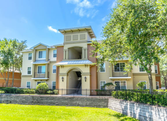 a large house with a tree in front of it