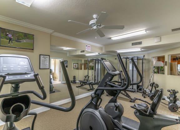 a room filled with lots of different types of exercise equipment