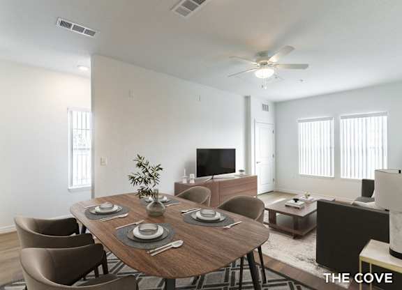 A dining room with a wooden table set for six.