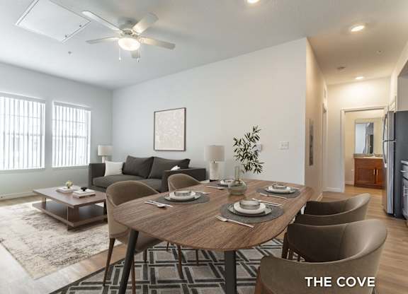A dining room with a table set for six.