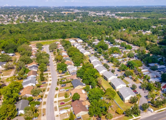 an aerial view of a neighborhood with houses and trees