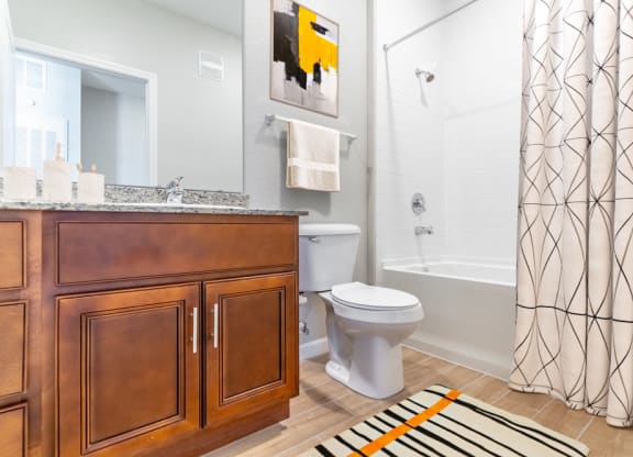 a bathroom with a shower curtain and a toilet