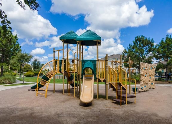 a playground with a slide and climbing equipment