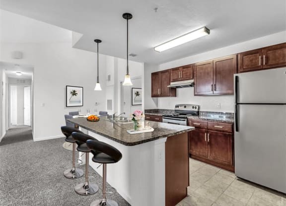 a kitchen with a counter top next to a stove top oven