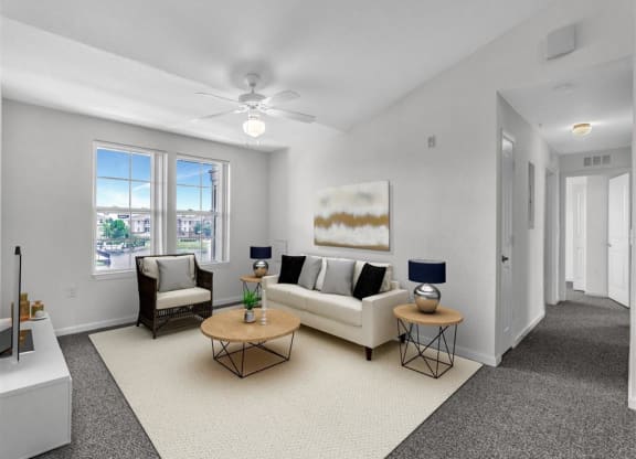 a living room with a couch and two tables