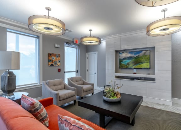 a living room with couches chairs and a coffee table