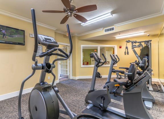 a fitness center with tv