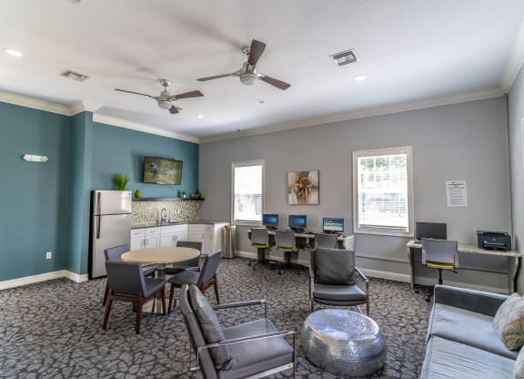 a room with couches and chairs and a table and chairs