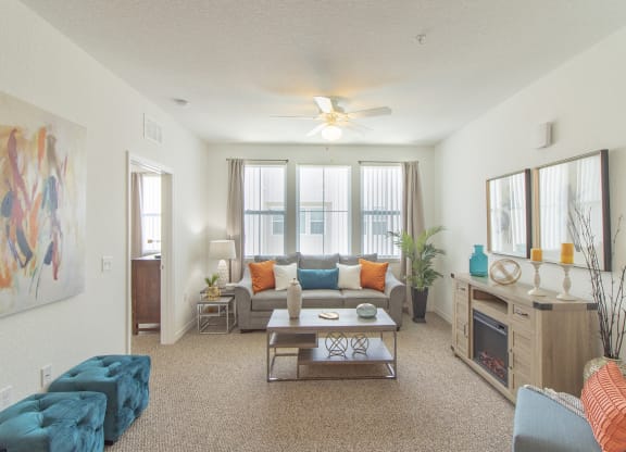 a living room with a couch coffee table and fireplace