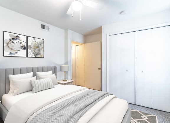 a bedroom with a bed and a wardrobe