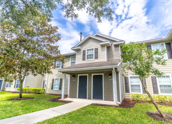 townhome exterior with lawn