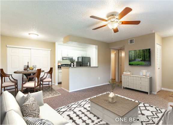 A living room with a dining table and a television.