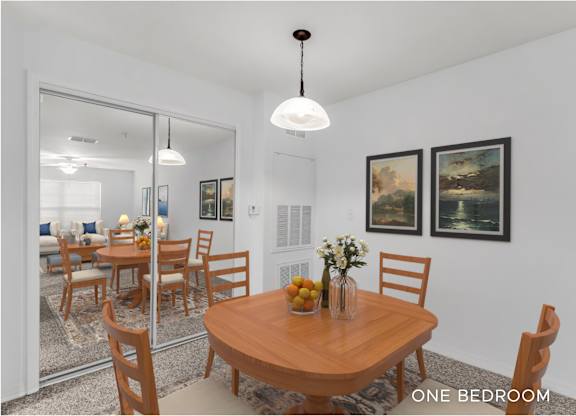 A dining room with a wooden table and chairs.