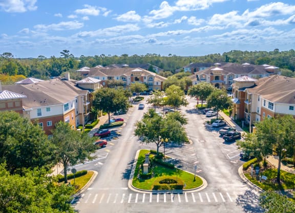 an aerial view of a neighborhood with houses and trees