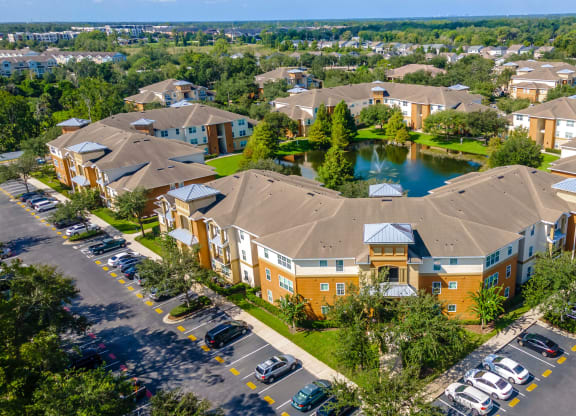 an aerial view of a community with houses and a lake