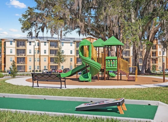 a playground area with playset and slide