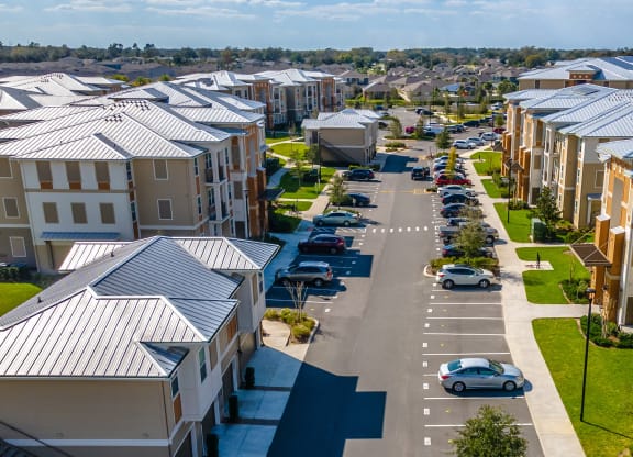 an aerial view of a street with rows of houses
