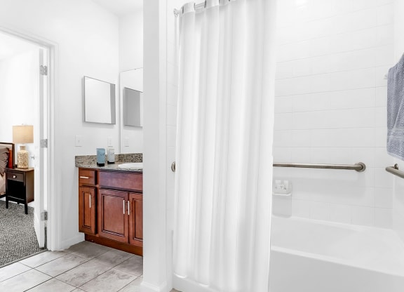 a bathroom with a bathtub and a sink