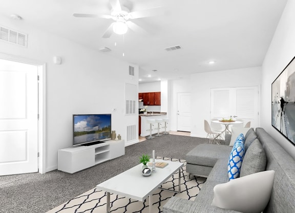 a living room with a gray couch and a white coffee table