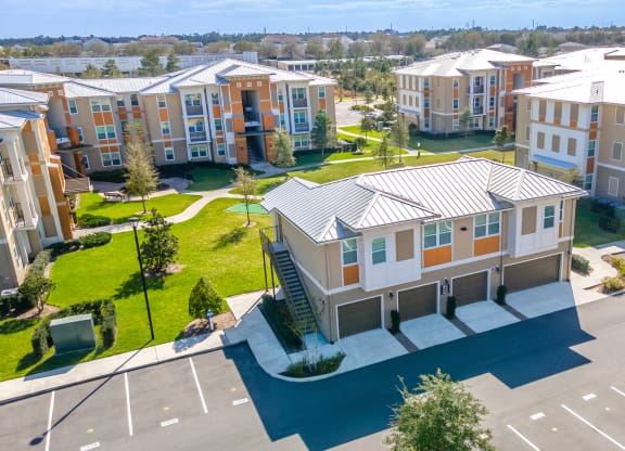 an aerial view of an apartment complex with a car parked in front of it
