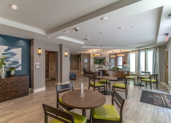 a resident clubhouse with tables and chairs