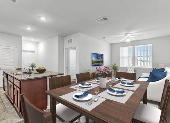 dining room with table and chairs with a kitchen and living room in the background