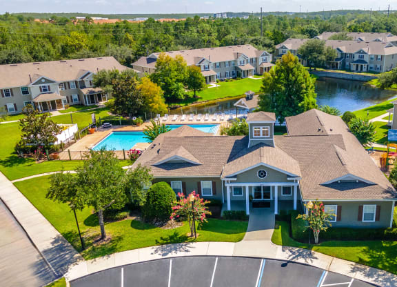 a large house with a swimming pool in front of it