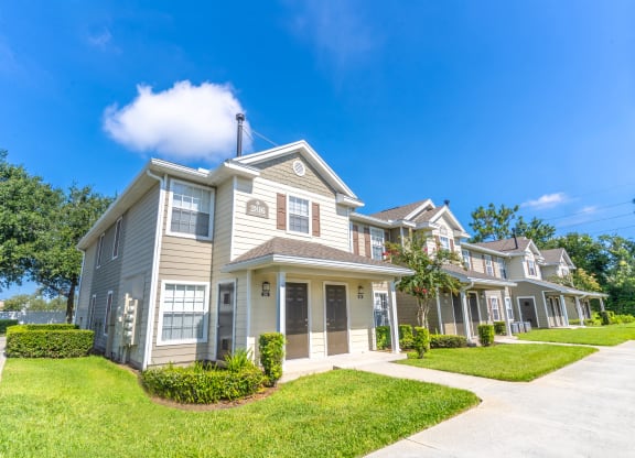 a large house with a blue sky in the background