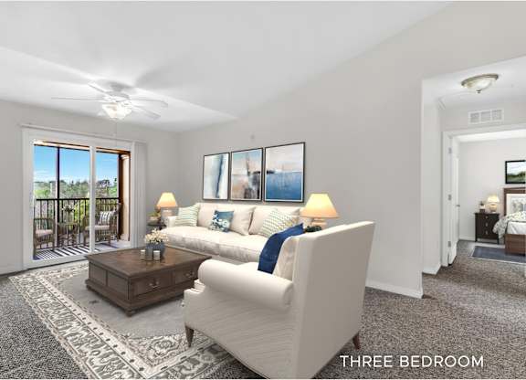 A well-lit, spacious living room with a three bedroom apartment.
